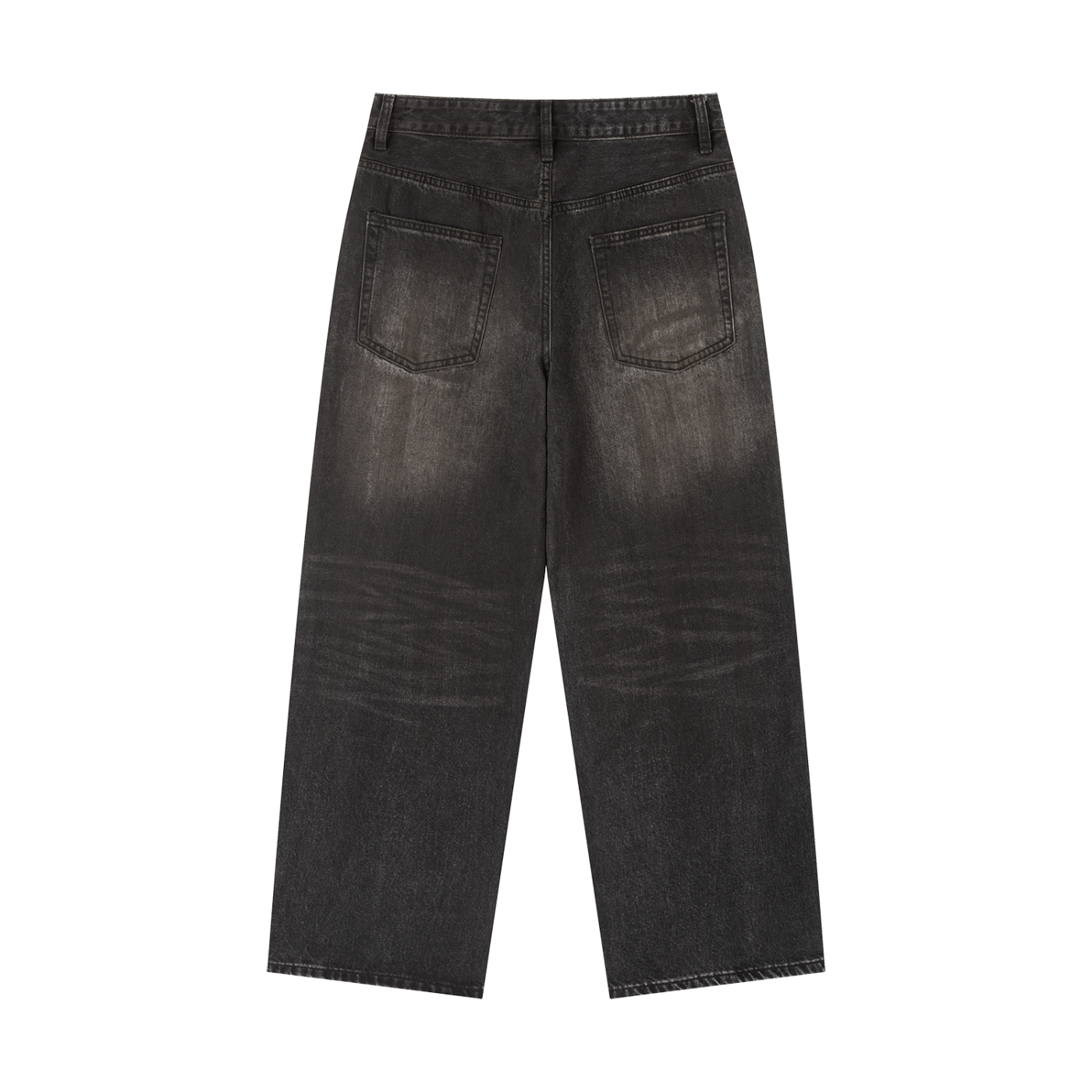 Back view of men's loose vintage wash heavyweight denim jeans in faded black with wide legs and rear patch pockets.